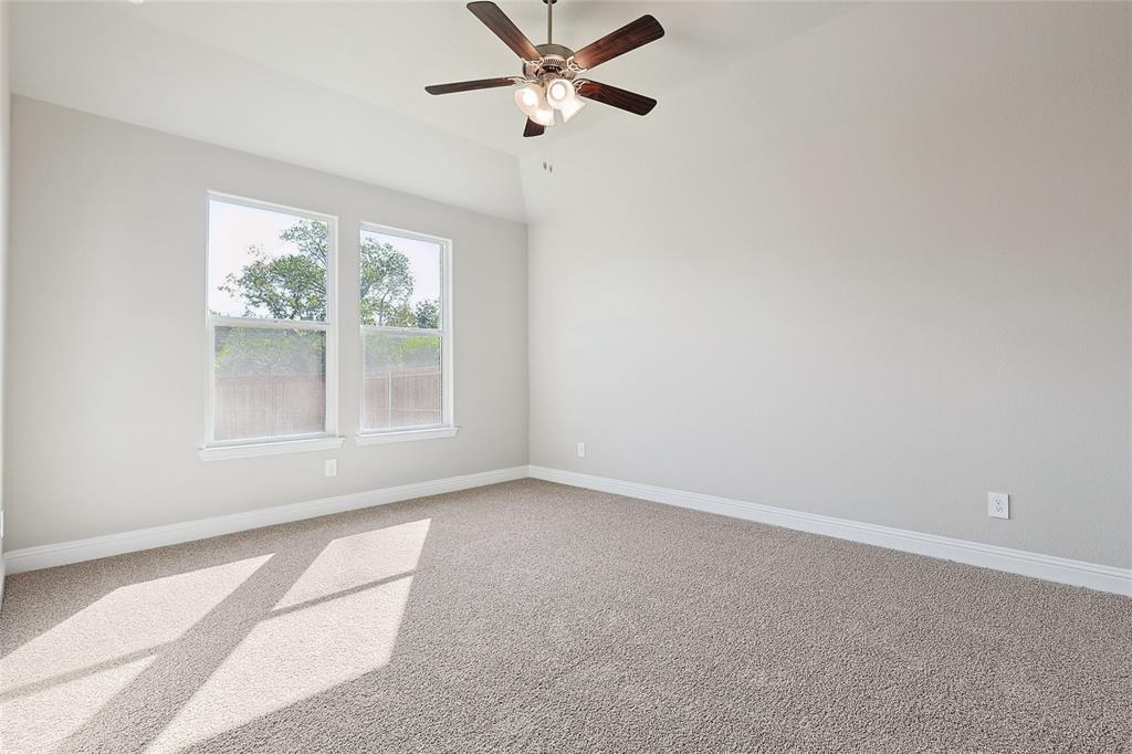 2217 Yellowhammer Road Denton, TX 76205 - Photo 21 of 30 an empty room with a window and a fan