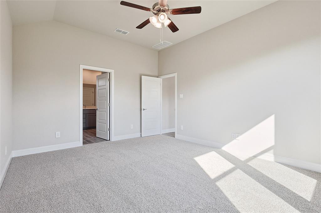 2217 Yellowhammer Road Denton, TX 76205 - Photo 22 of 30 an empty room with closet and a ceiling fan
