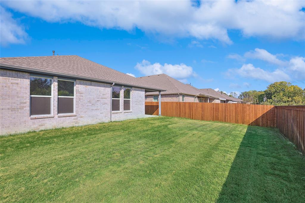 2217 Yellowhammer Road Denton, TX 76205 - Photo 30 of 30 a view of a backyard with a garden