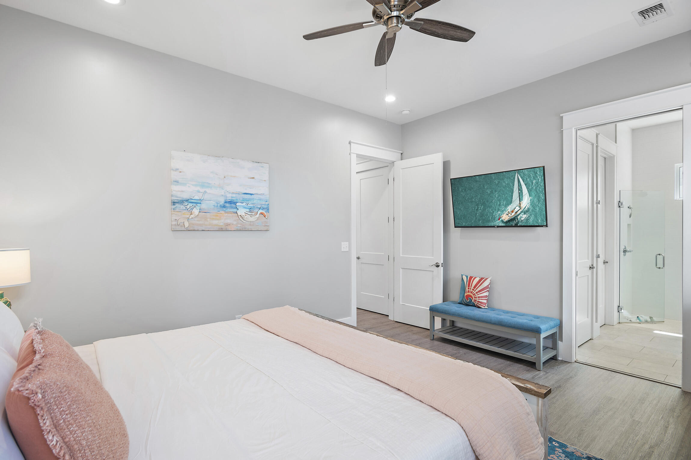 459 Dolphin Drive Santa Rosa Beach, FL 32459 - Photo 16 of 31 a bedroom with a bed and a chandelier