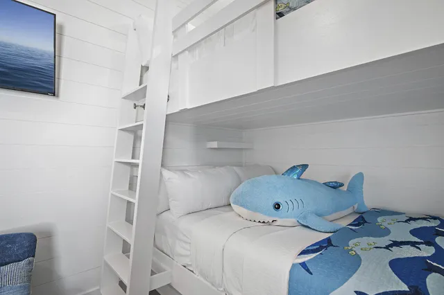 a bedroom with a bed and cabinets