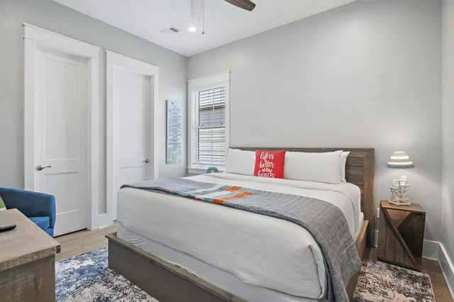 a bedroom with a bed and a table