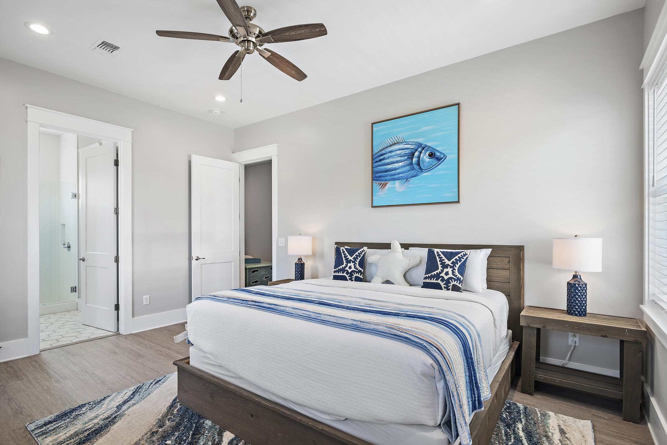 459 Dolphin Drive Santa Rosa Beach, FL 32459 - Photo 29 of 31 a bedroom with a bed and a chandelier