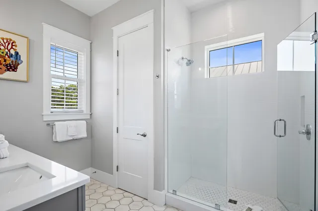 a bathroom with a sink and a shower