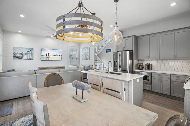 a kitchen with cabinets a sink and appliances