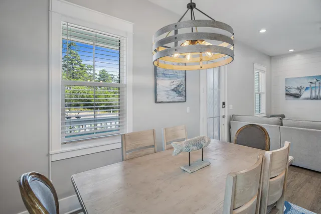 a bathroom with a granite countertop sink a mirror and a bathtub