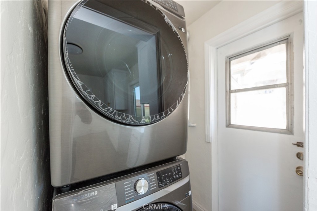8713 Alondra Boulevard Paramount, CA 90723 - Photo 11 of 41 a view of a livingroom with washer and dryer