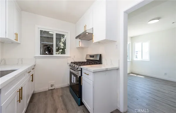 a kitchen with a stove and a sink