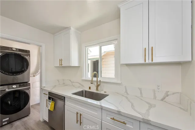 a kitchen with a sink and cabinets