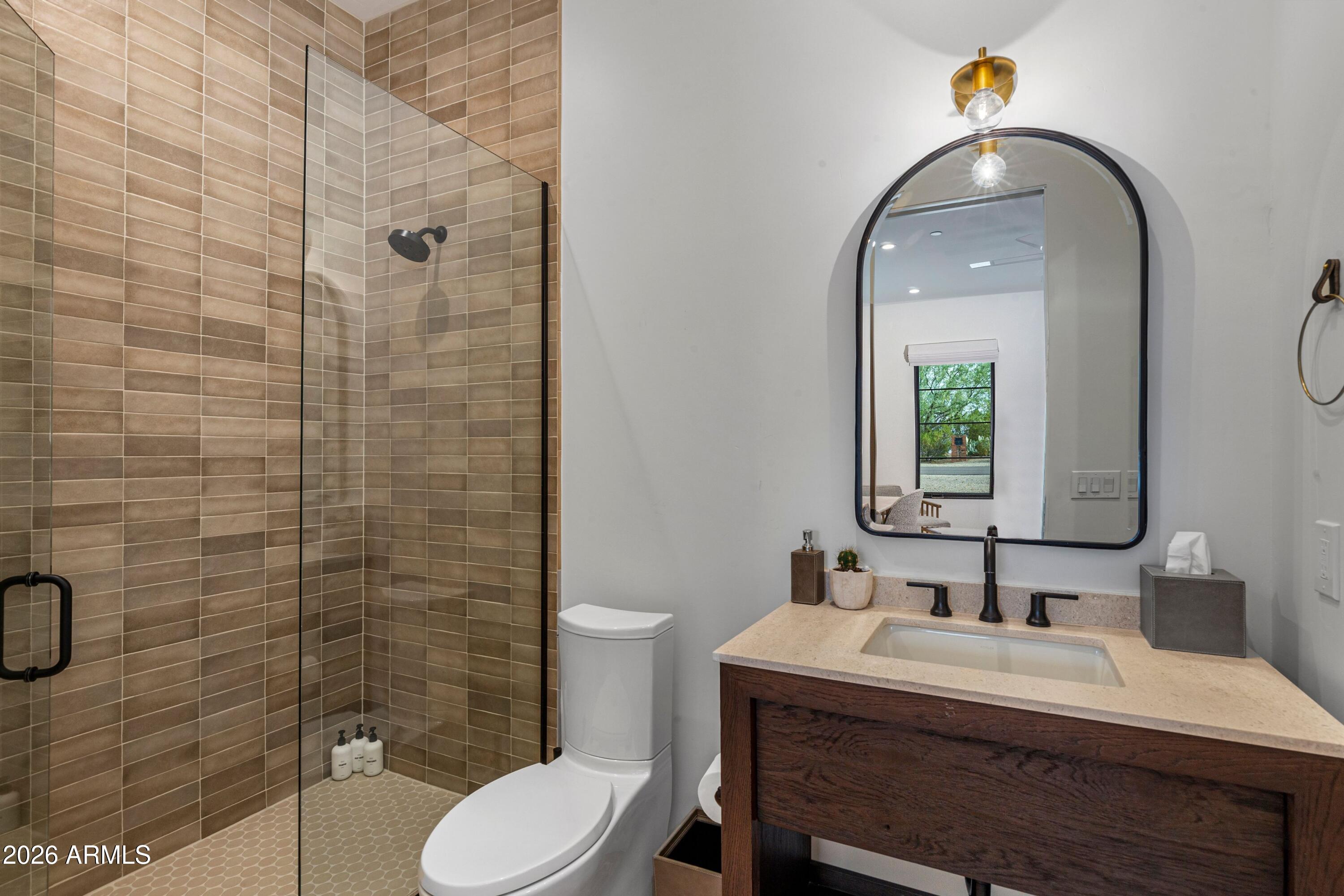 8307 East Gary Road Scottsdale, AZ 85260 - Photo 20 of 34 a bathroom with a sink a toilet and shower