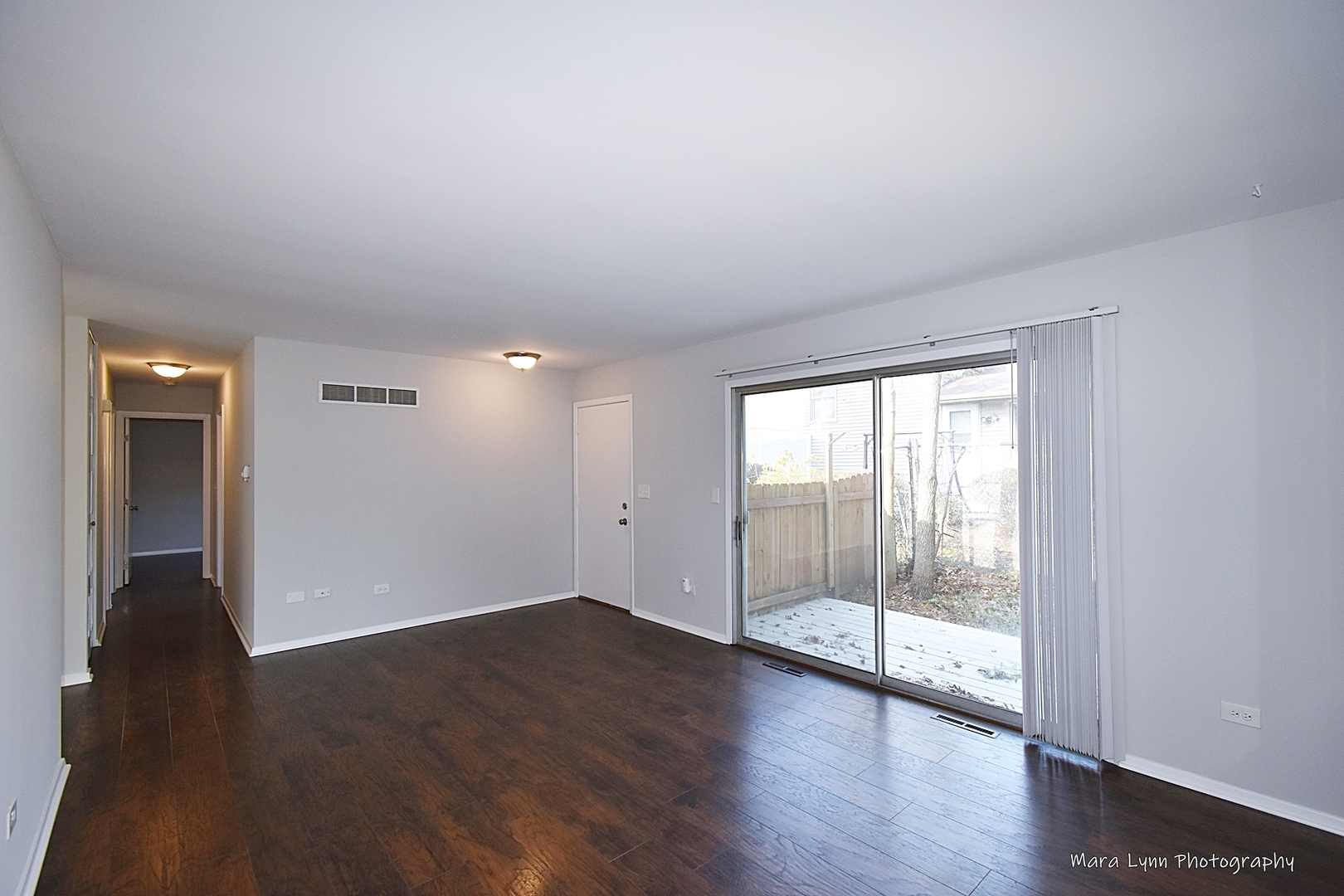 313 South Hawthorne Street Elgin, IL 60123 - Photo 14 of 22 a view of wooden floor and windows in a room