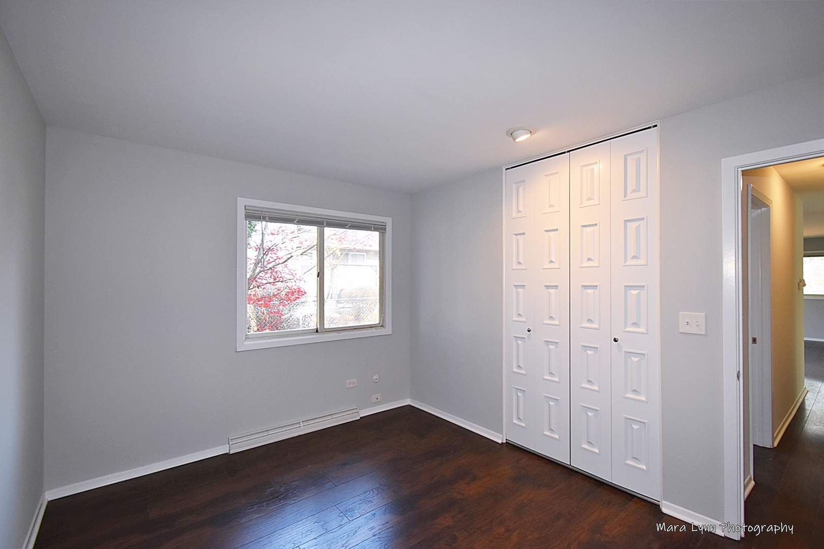 313 South Hawthorne Street Elgin, IL 60123 - Photo 19 of 22 an empty room with wooden floor cabinet and windows
