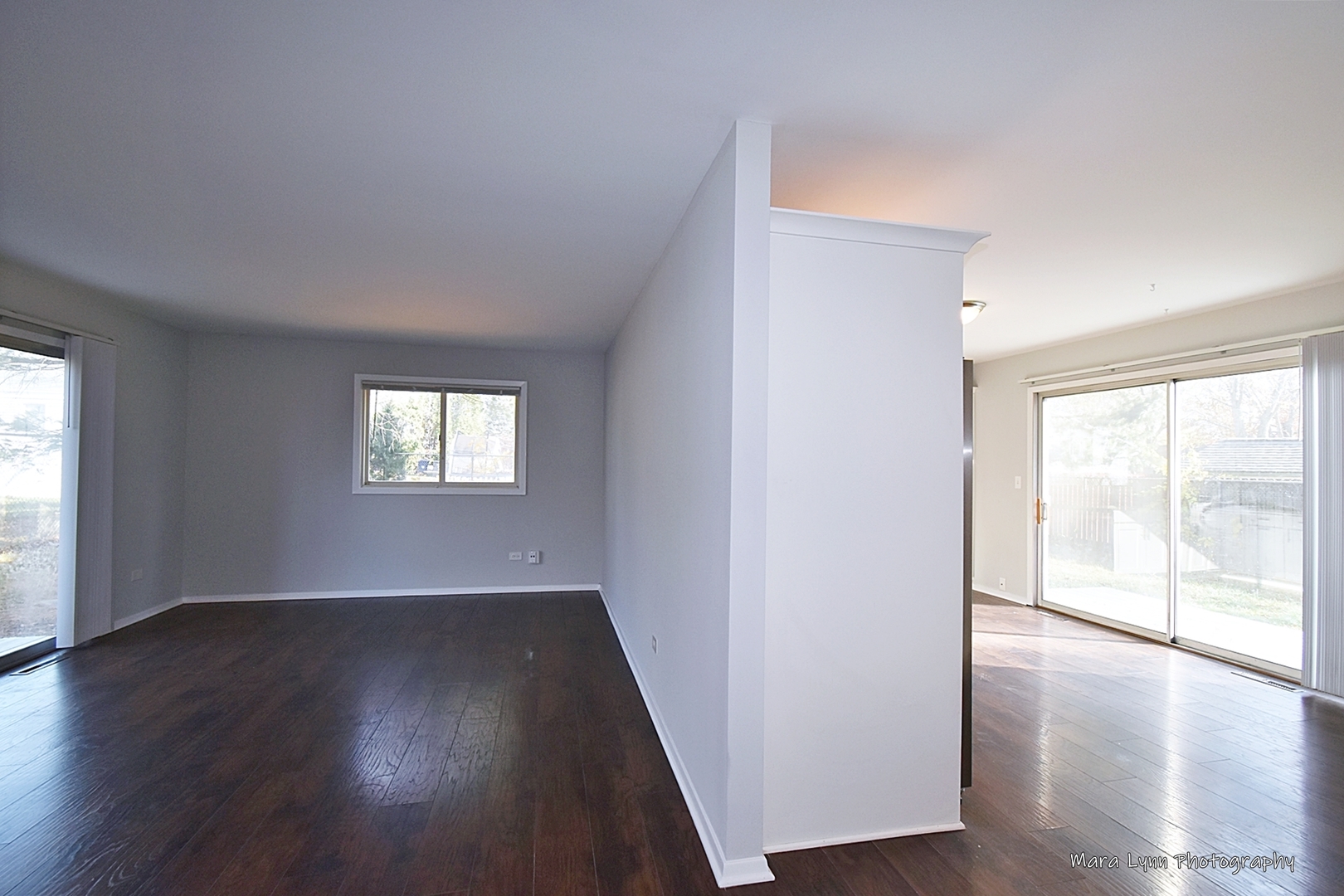 313 South Hawthorne Street Elgin, IL 60123 - Photo 5 of 22 an empty room with wooden floor and windows