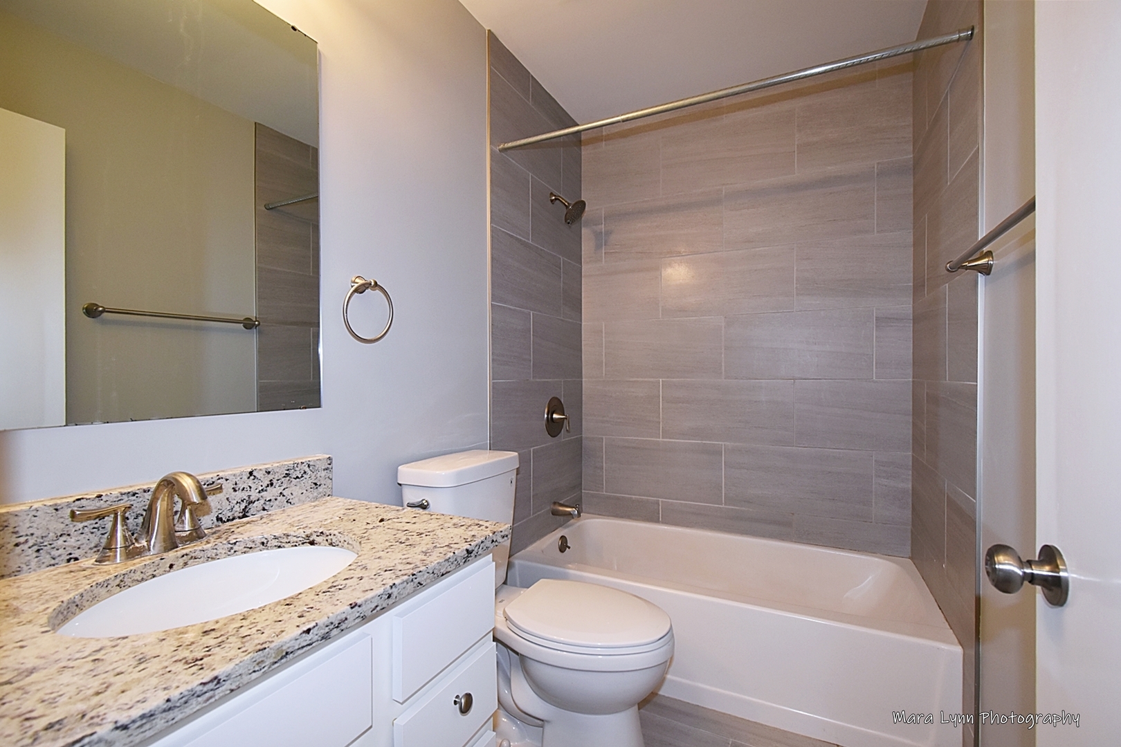 313 South Hawthorne Street Elgin, IL 60123 - Photo 7 of 22 a bathroom with a granite countertop sink toilet and shower