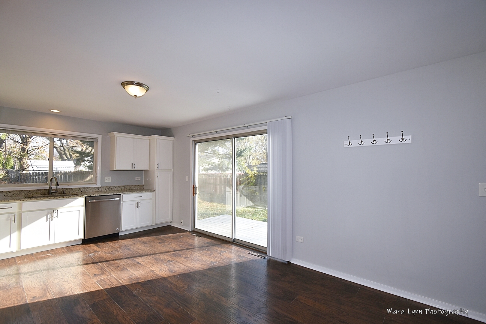 313 South Hawthorne Street Elgin, IL 60123 - Photo 9 of 22 a view of a kitchen with a sink and dishwasher cabinets
