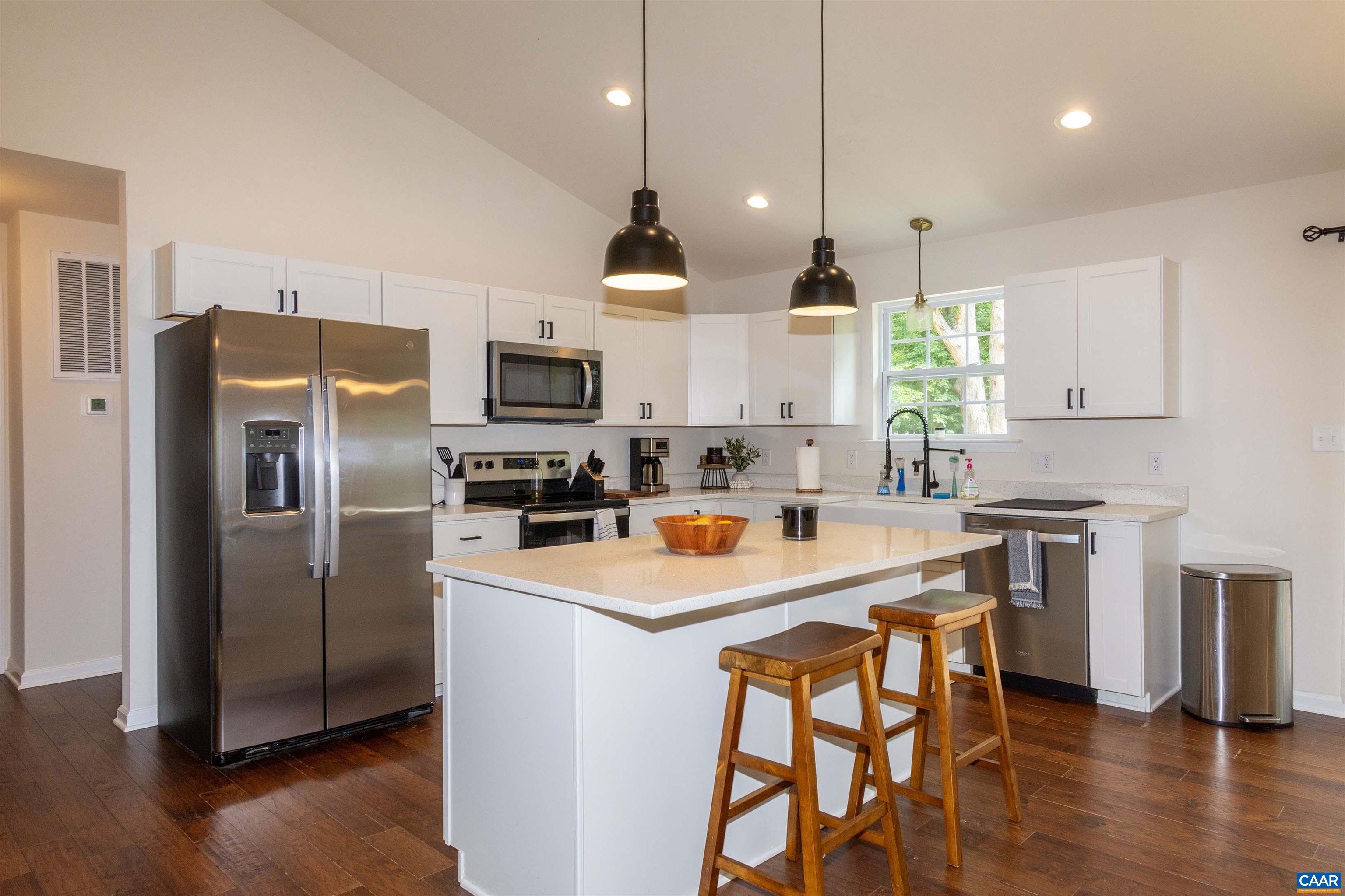 13079 Kendall Road Orange, VA 22960 - Photo 11 of 57 with large island for food prep and overhang for informal dining. Pendant lights and granite counters.
