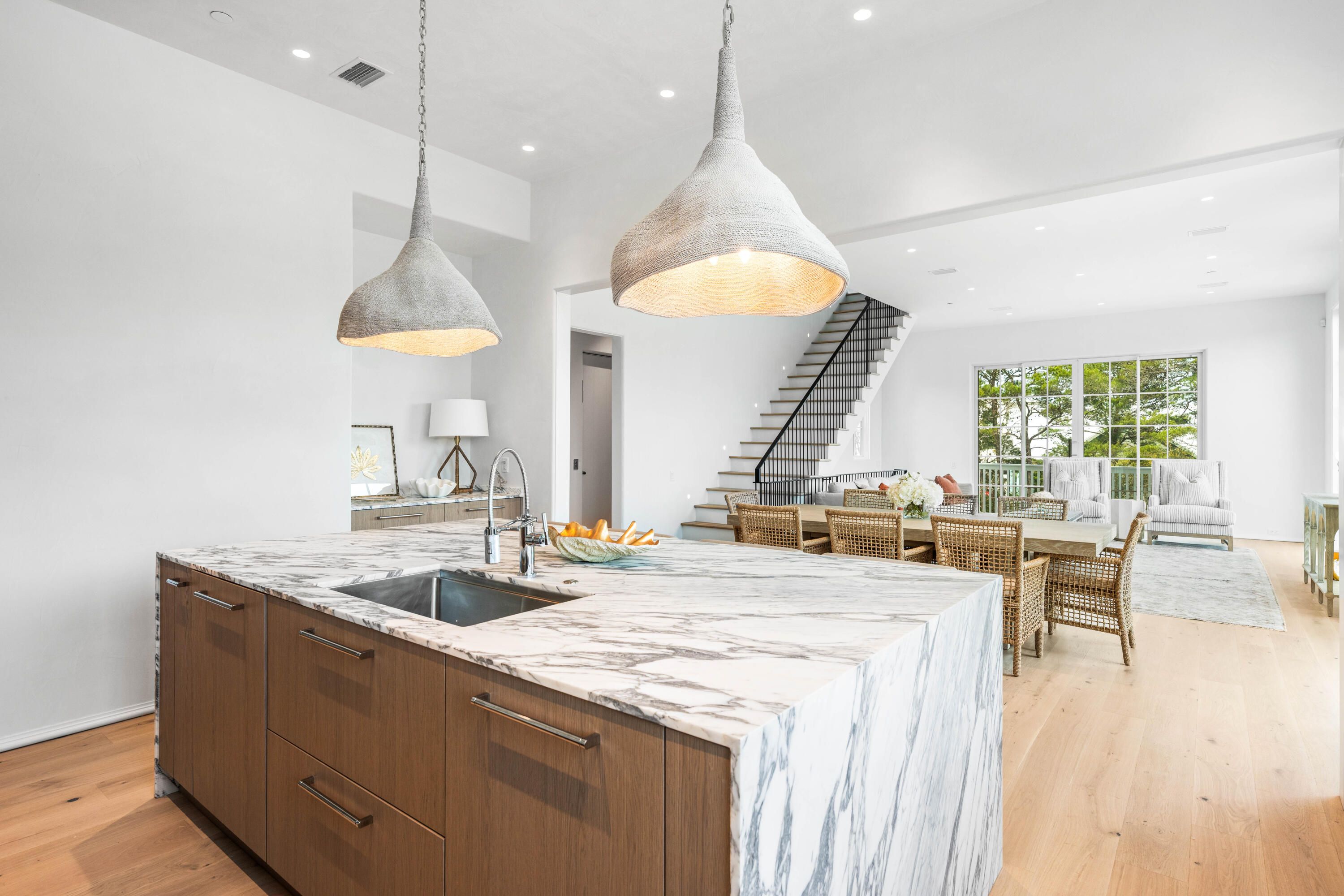 4655 East County Highway 30A Santa Rosa Beach, FL 32459 - Photo 14 of 69 a kitchen with stainless steel appliances granite countertop a sink a stove and a wooden floors