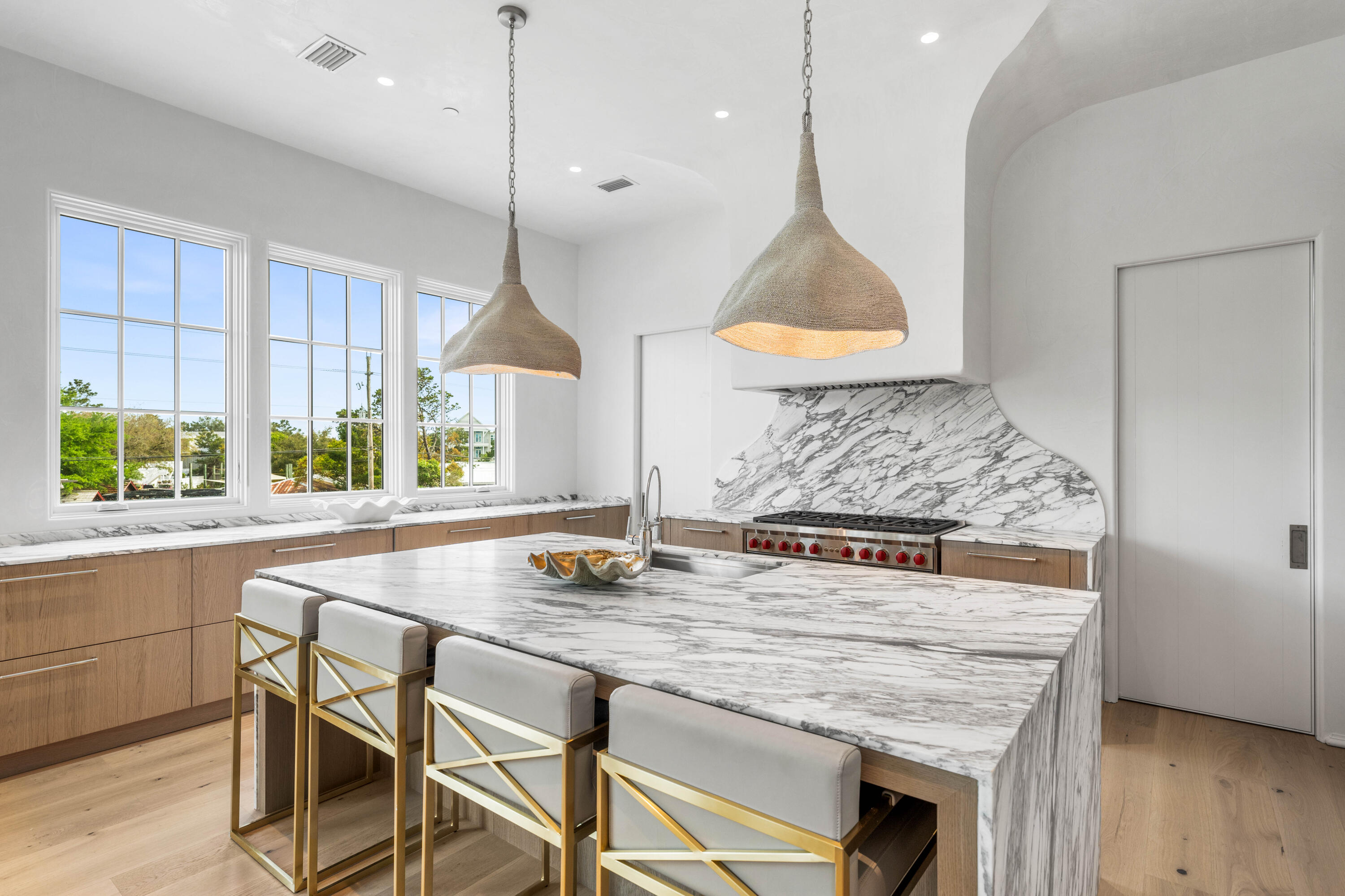 4655 East County Highway 30A Santa Rosa Beach, FL 32459 - Photo 20 of 69 a kitchen with a table a sink and cabinets