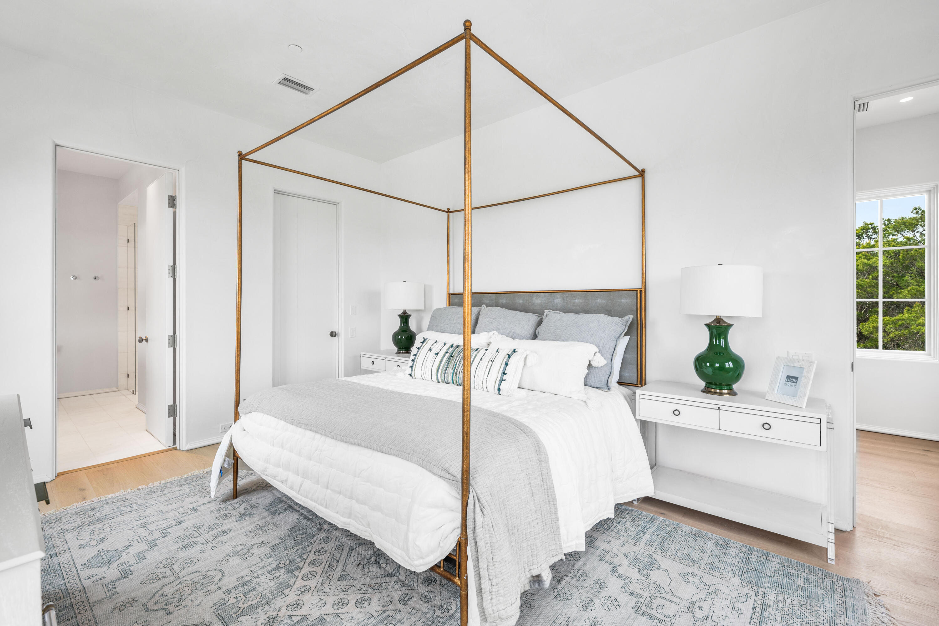 4655 East County Highway 30A Santa Rosa Beach, FL 32459 - Photo 30 of 69 a bedroom with a large bed and a chandelier