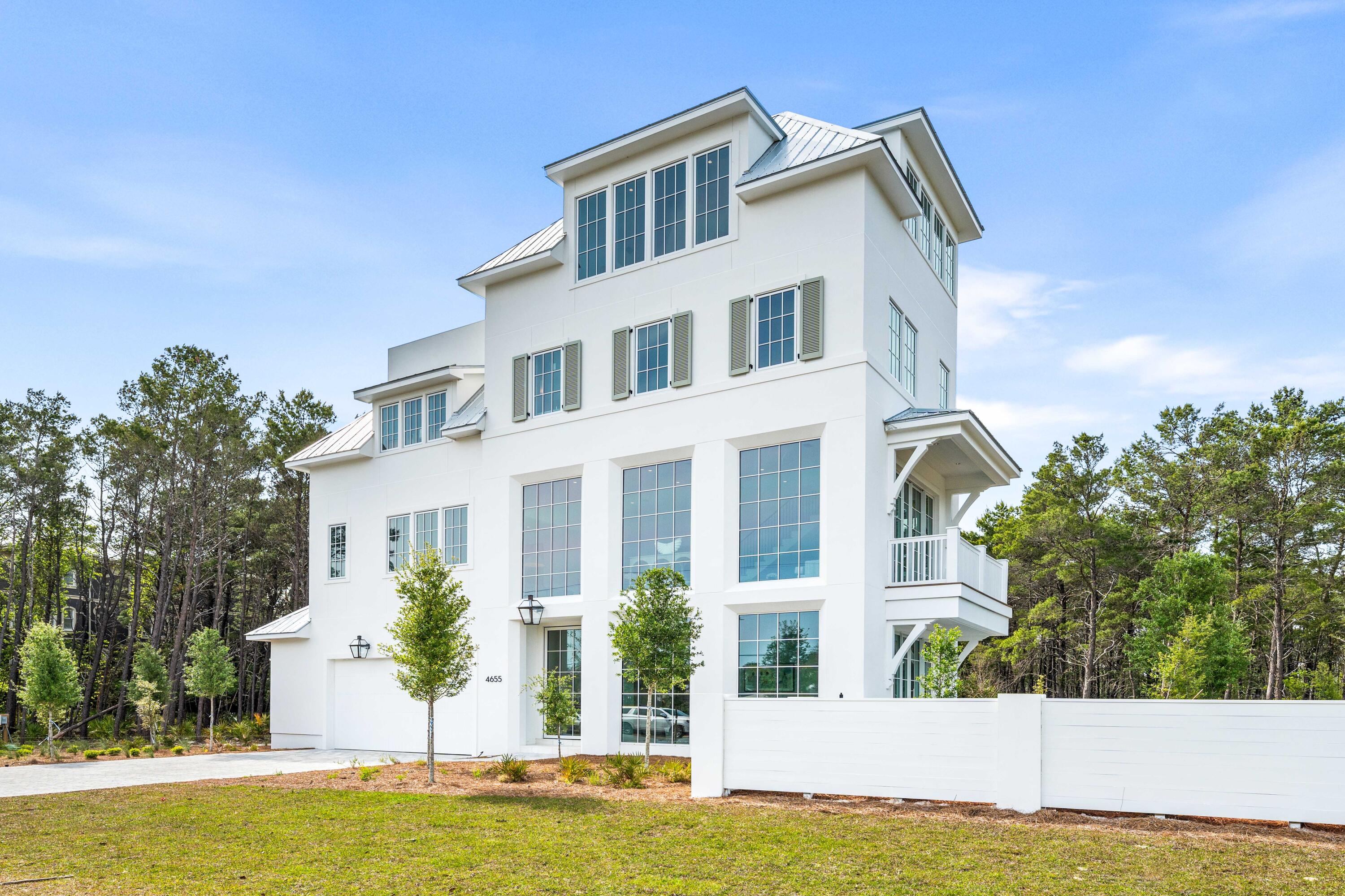 4655 East County Highway 30A Santa Rosa Beach, FL 32459 - Photo 3 of 69 a front view of a house with a yard