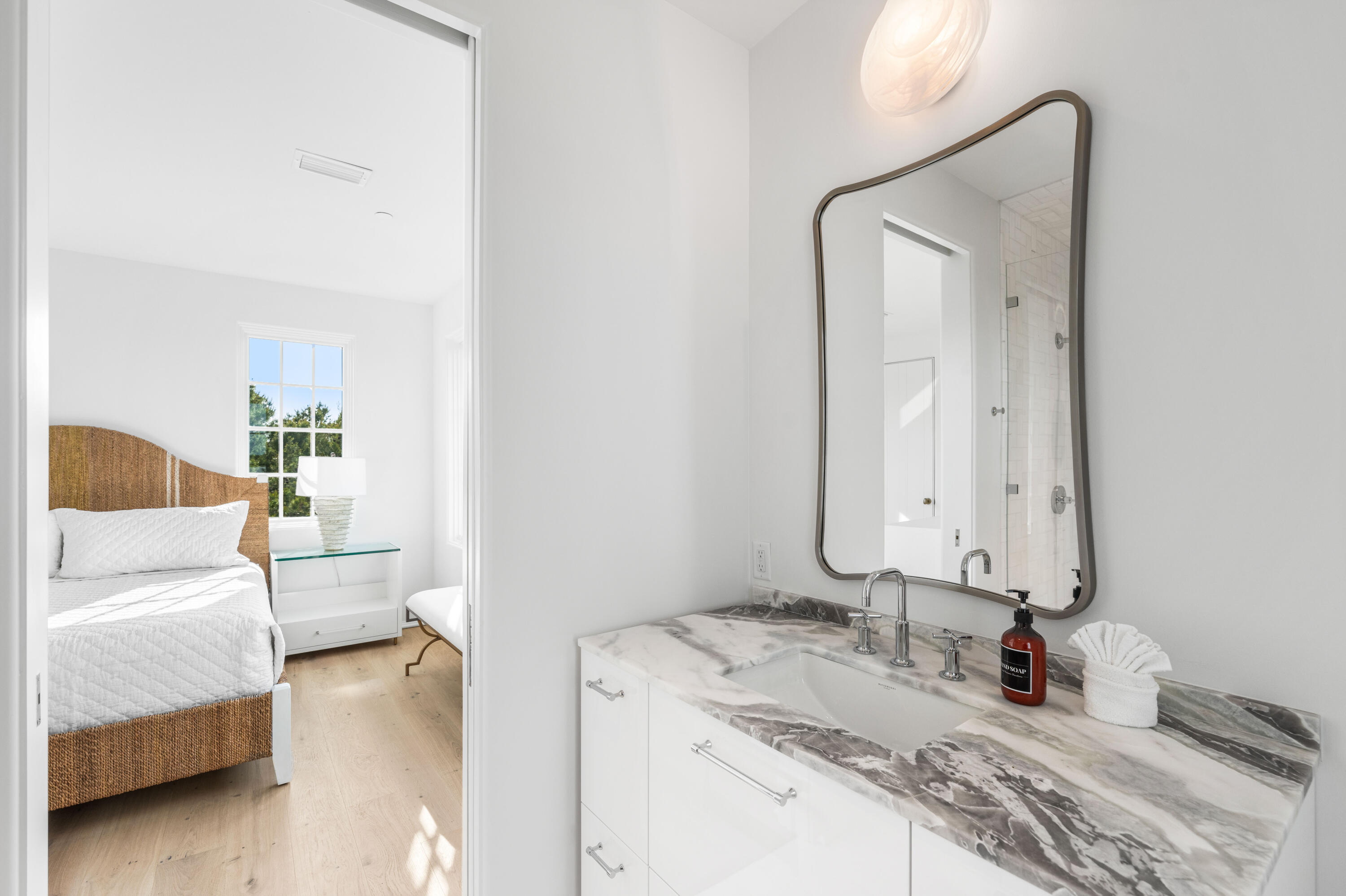 4655 East County Highway 30A Santa Rosa Beach, FL 32459 - Photo 47 of 69 a en suite bathroom with a double vanity sink and a mirror