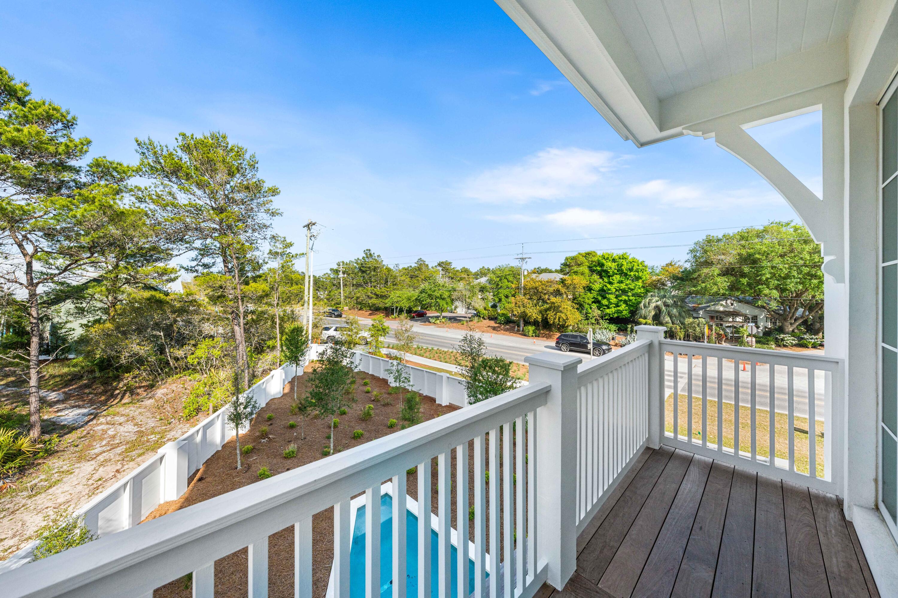 4655 East County Highway 30A Santa Rosa Beach, FL 32459 - Photo 50 of 69 a view of a balcony with wooden floor and fence