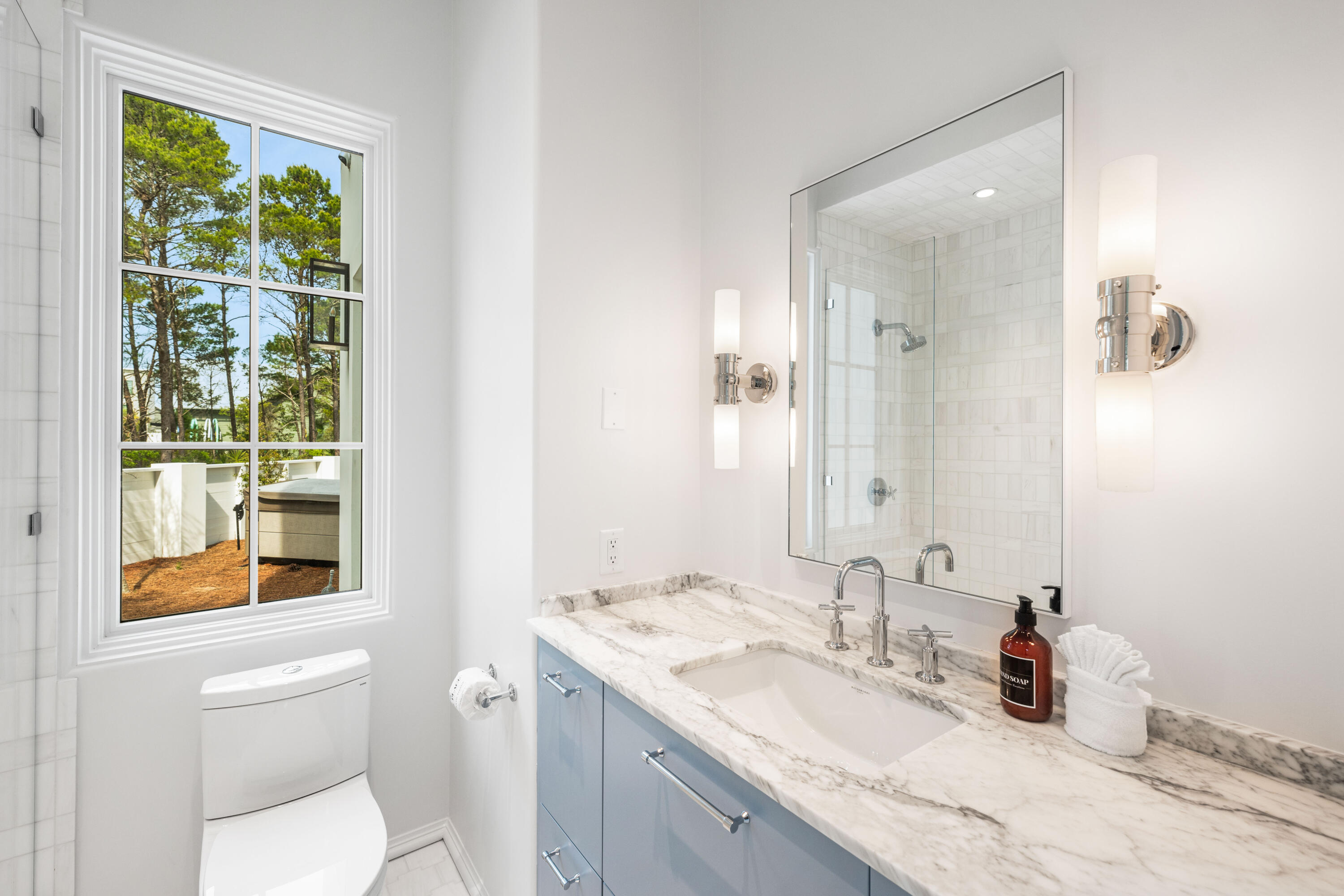 4655 East County Highway 30A Santa Rosa Beach, FL 32459 - Photo 10 of 69 a bathroom with a granite countertop sink mirror and a toilet