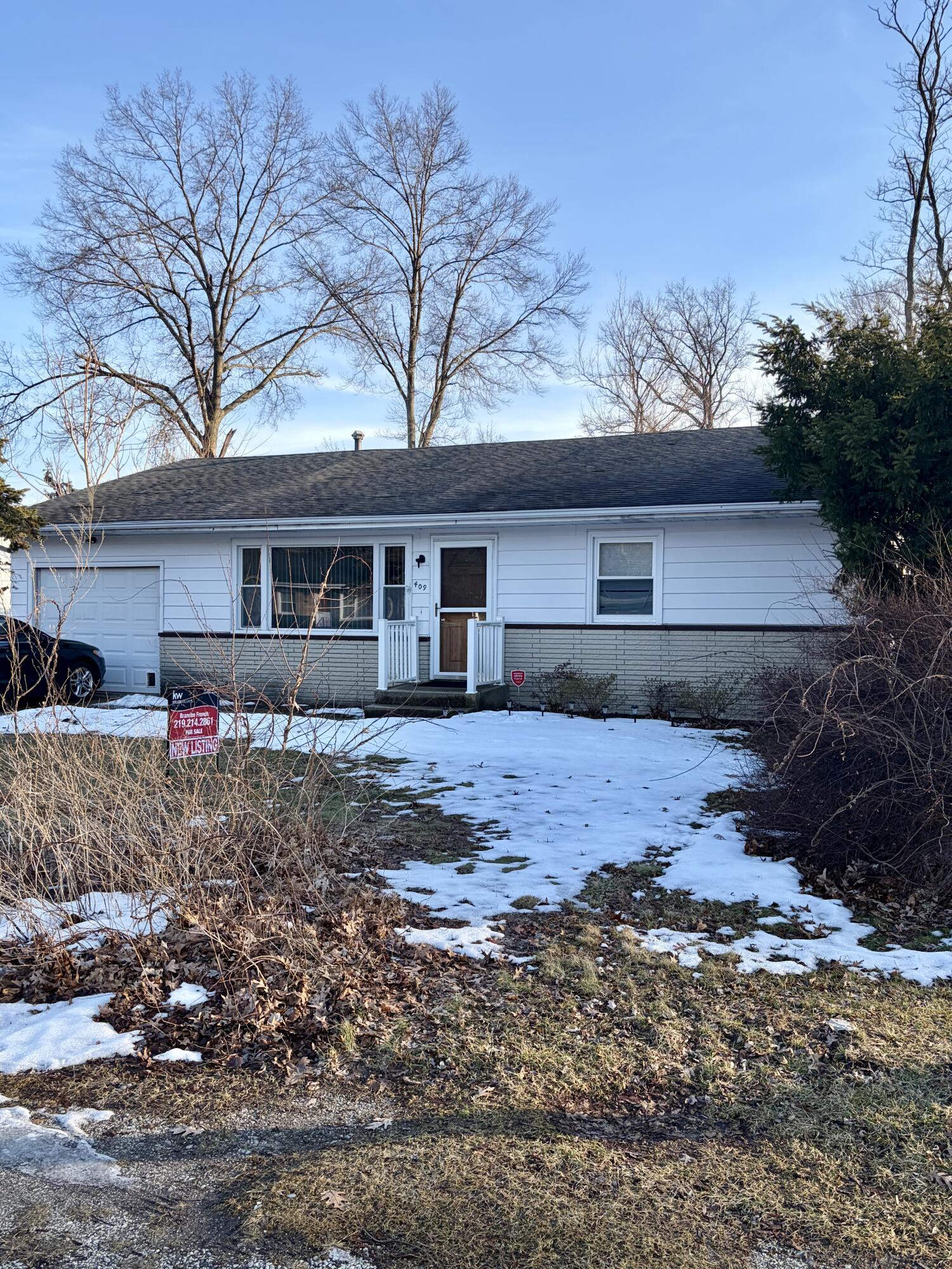 409 Holly Road Michigan City, IN 46360 - Photo 1 of 20 a front view of house with yard and trees