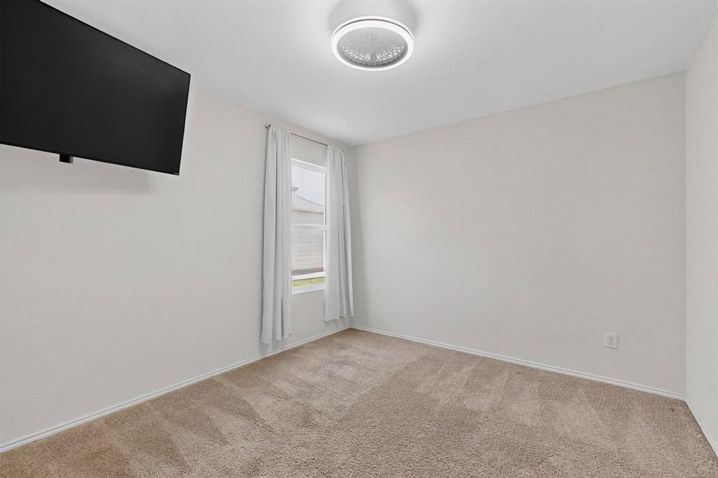 5516 McClelland Street Forney, TX 75126 - Photo 23 of 36 Empty room featuring carpet flooring and baseboards