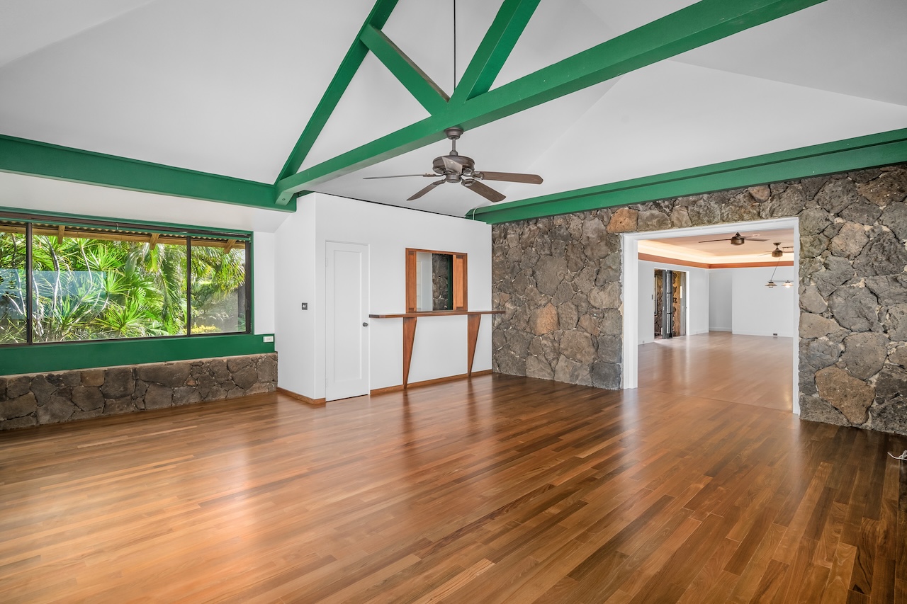 1801 Pe'e Road Koloa, HI 96756 - Photo 13 of 30 a view of empty room with wooden floor and fan