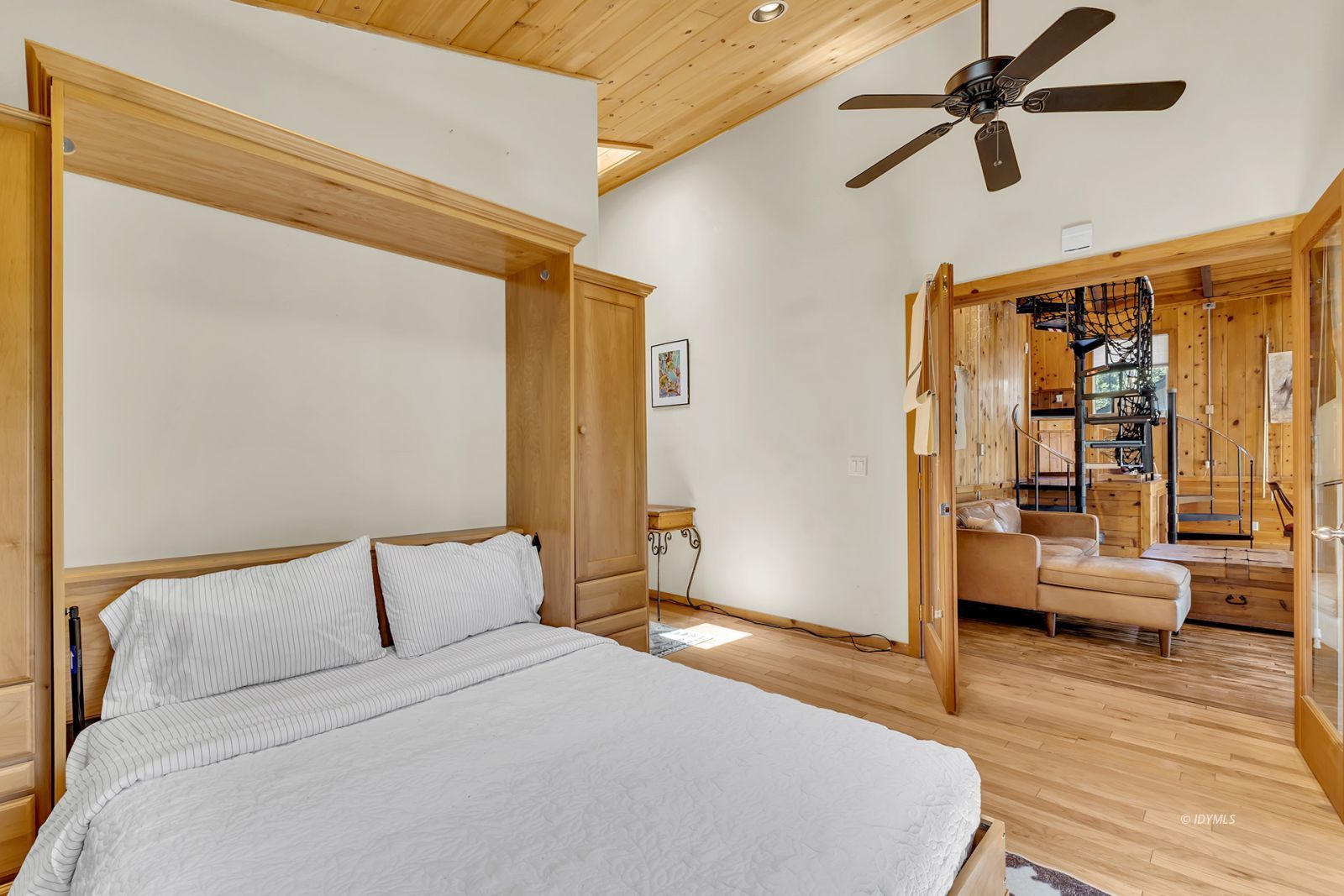 53560 Country Club Drive Idyllwild, CA 92549 - Photo 17 of 66 a bedroom with a bed couch and a window