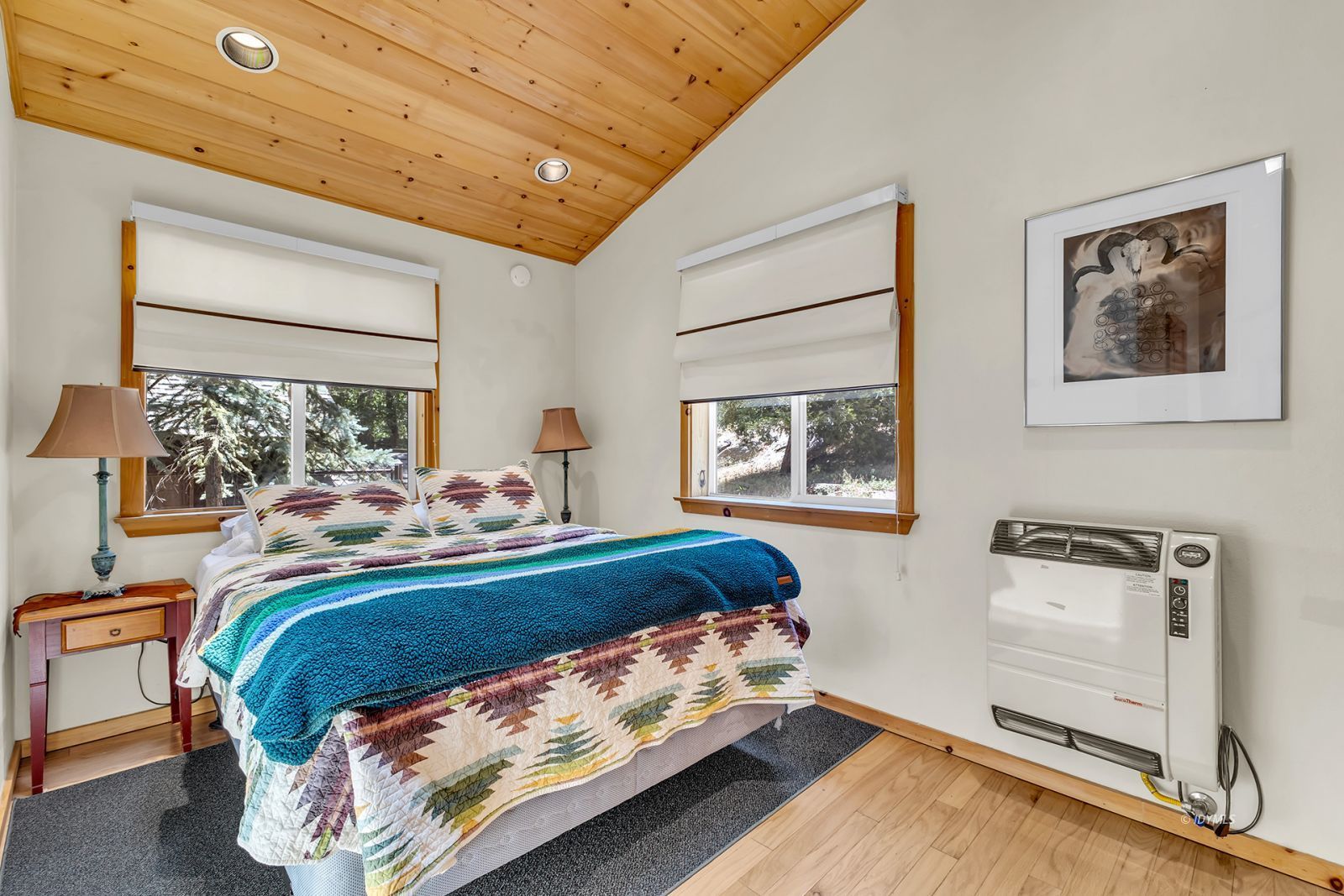 53560 Country Club Drive Idyllwild, CA 92549 - Photo 19 of 66 a bed sitting in a bedroom next to a window