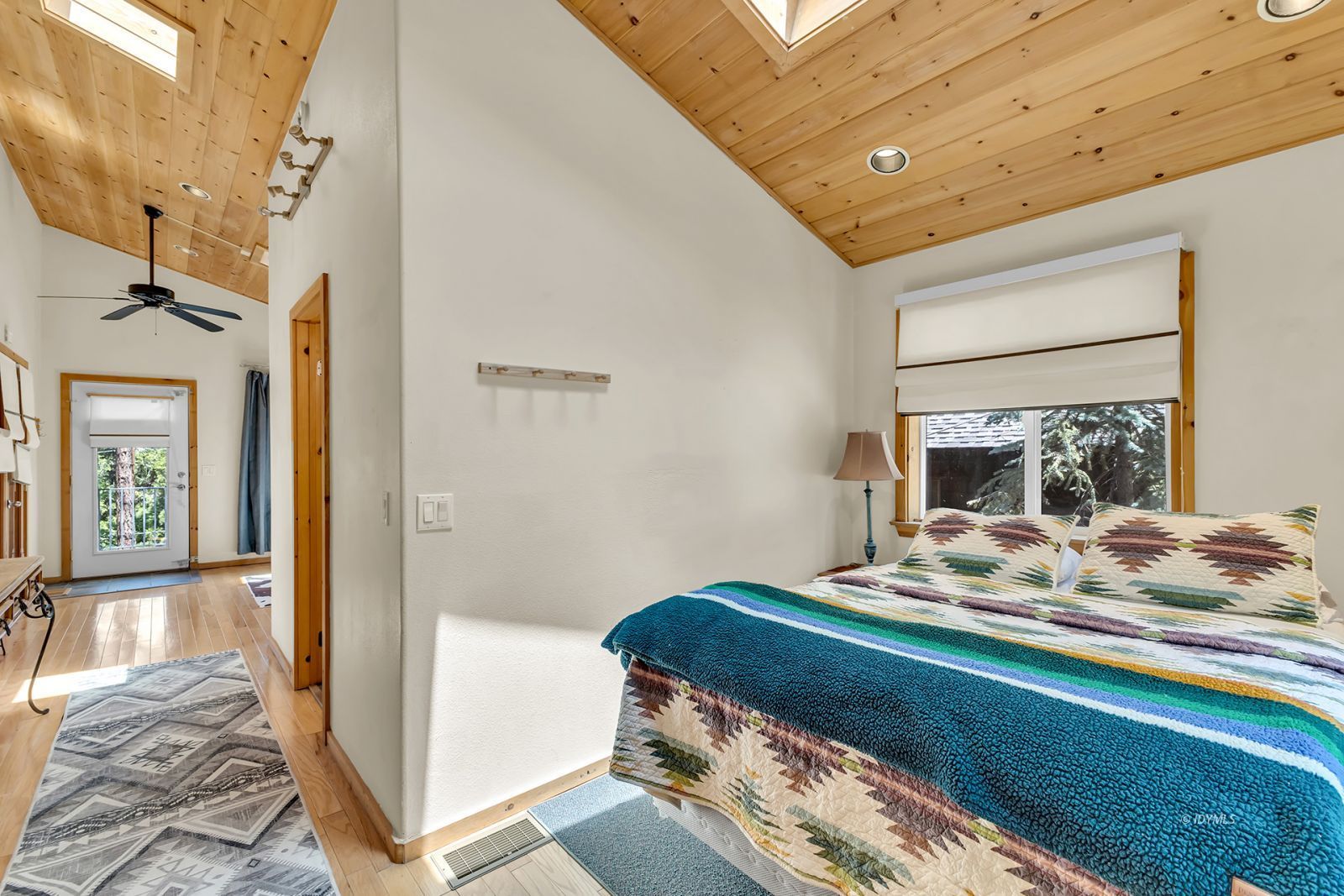 53560 Country Club Drive Idyllwild, CA 92549 - Photo 20 of 66 a bedroom with a bed and a mirror