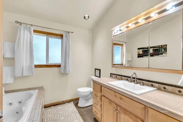 a view of a house with a snow on the road