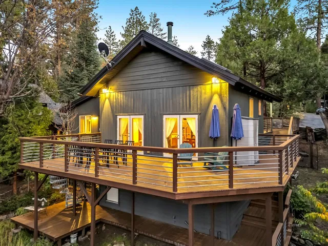 a view of swimming pool with garden and patio