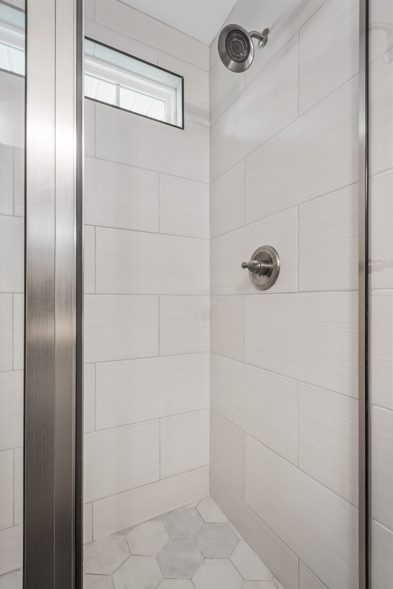 357 Fieldstone Lane Springfield, TN 37172 - Photo 25 of 46 a bathroom with a glass shower door and a shower