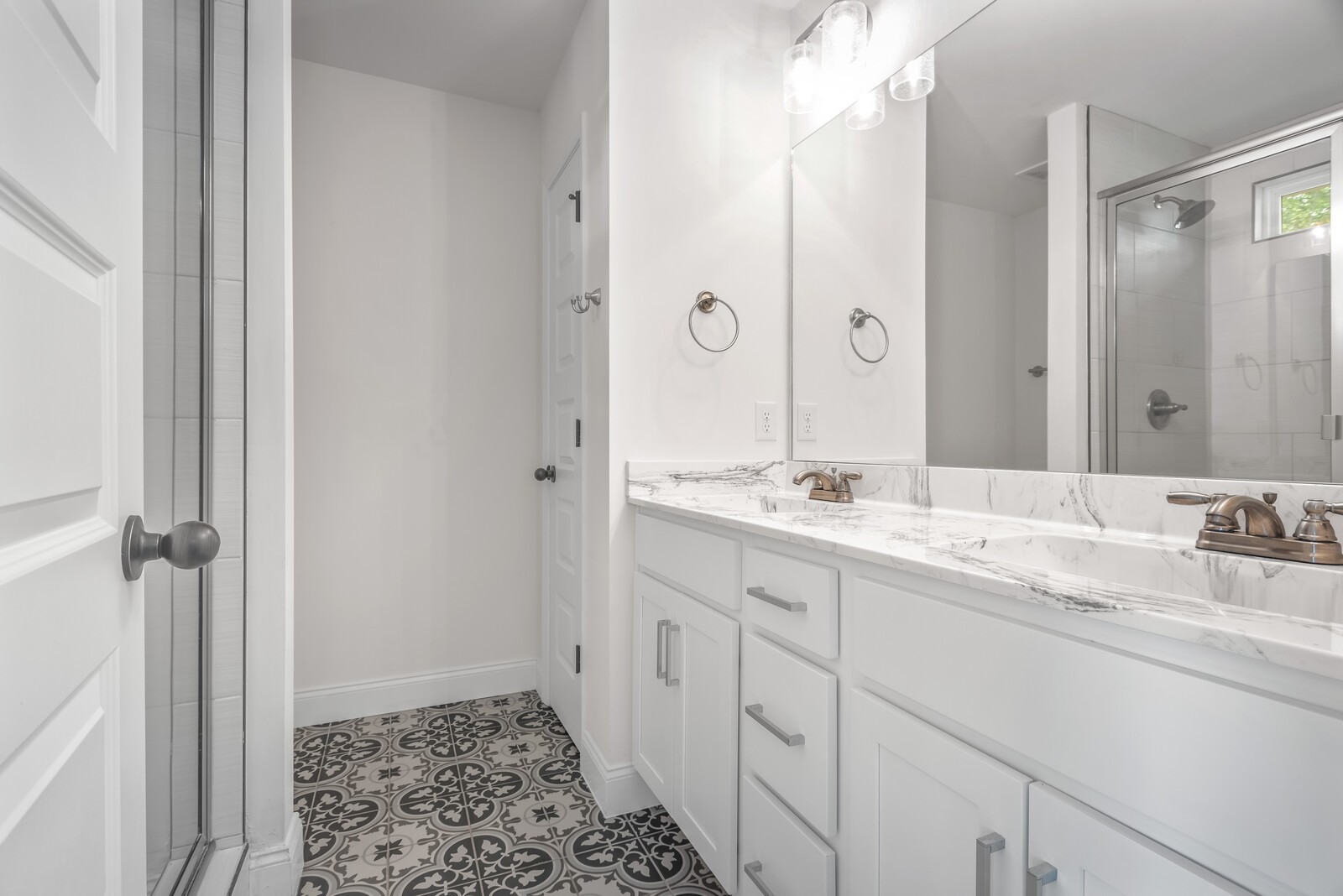 357 Fieldstone Lane Springfield, TN 37172 - Photo 27 of 46 a bathroom with a double vanity sink and mirror with shower