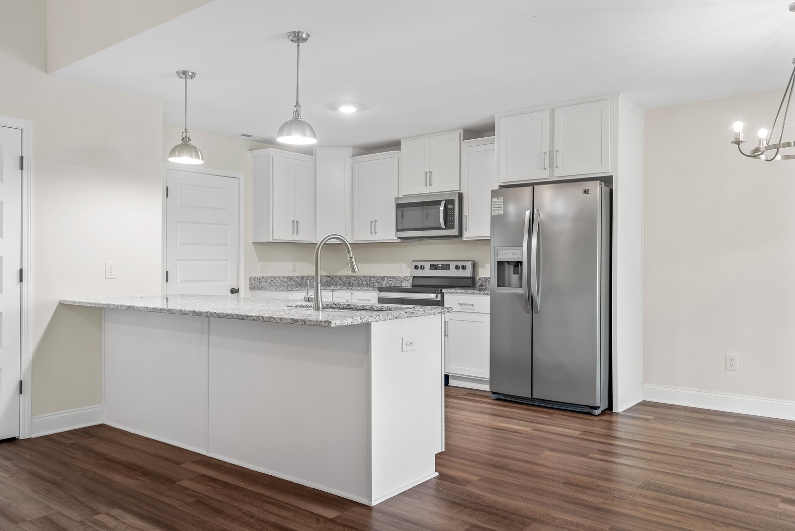 357 Fieldstone Lane Springfield, TN 37172 - Photo 6 of 46 a kitchen with kitchen island white cabinets a refrigerator a sink and wooden floor