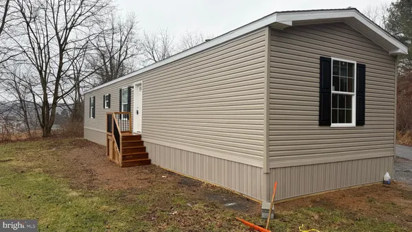 a view of a house with a yard and garage