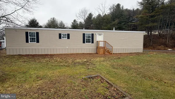a view of a backyard of the house