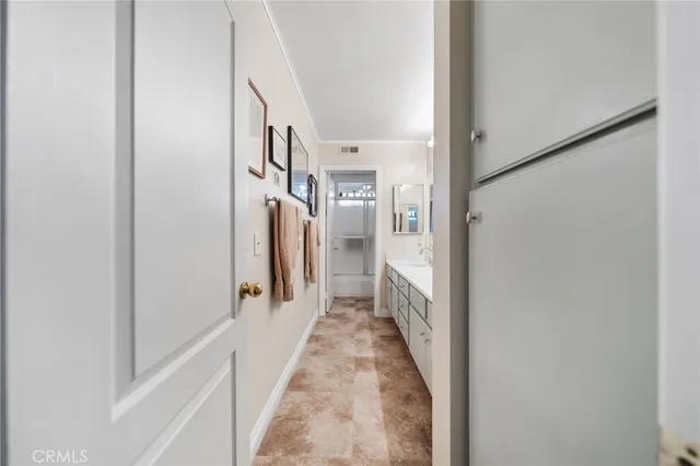 a view of a hallway with white walls