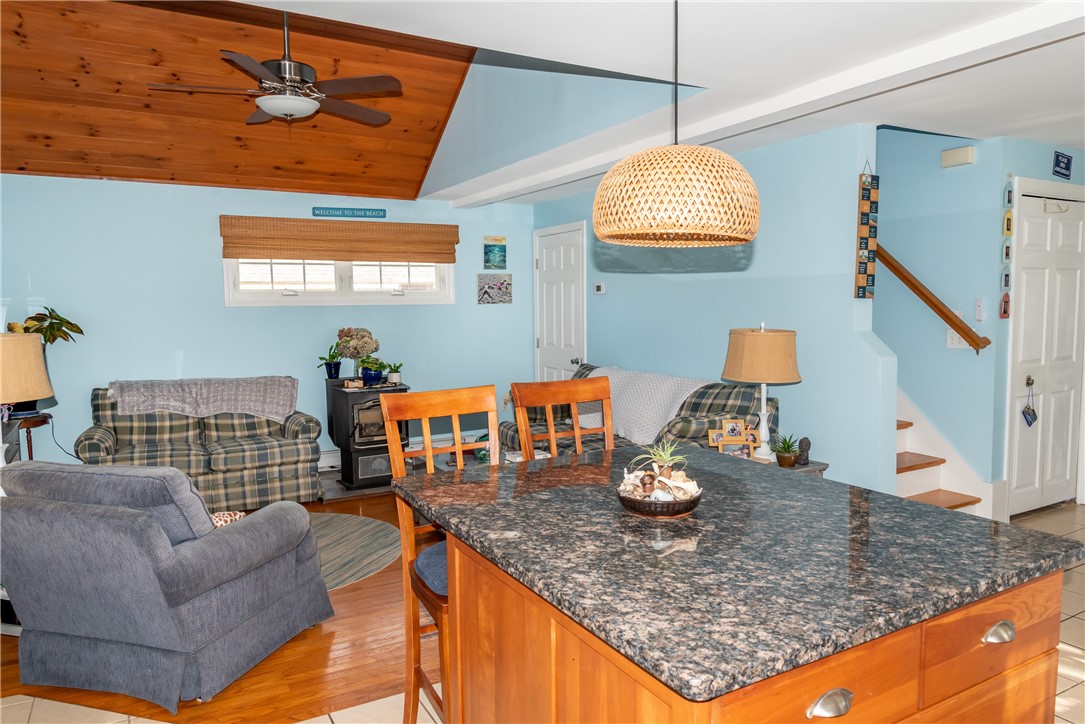 17 West Side Road South Kingstown, RI 02879 - Photo 23 of 49 View from kitchen to family room with an island and seating for two