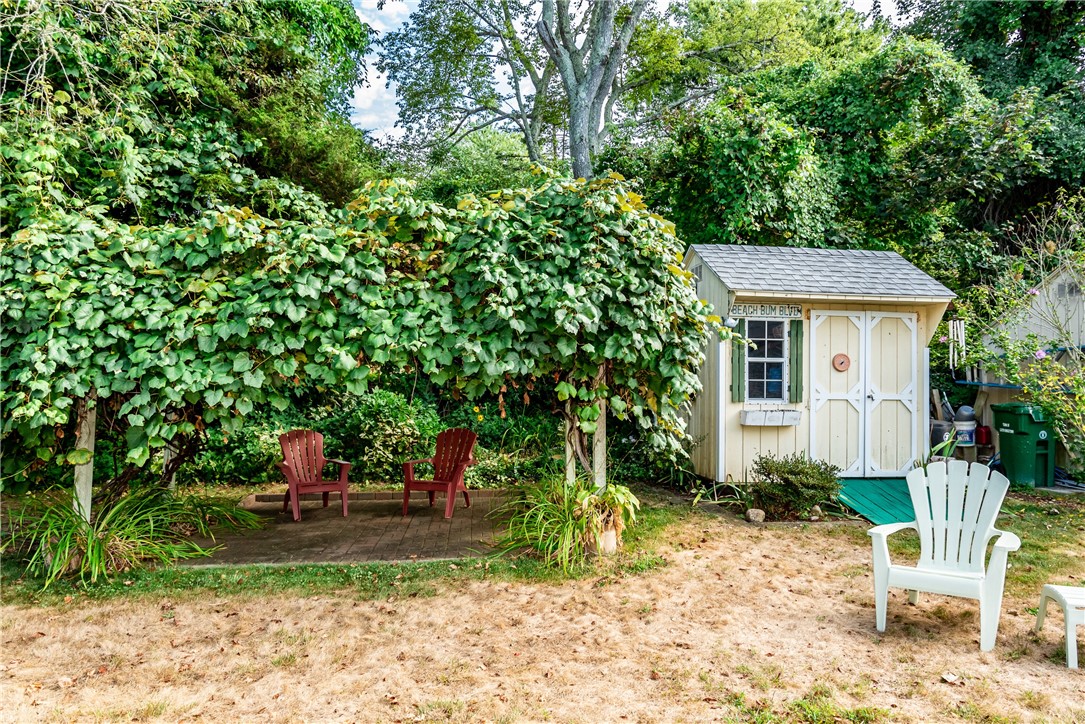 17 West Side Road South Kingstown, RI 02879 - Photo 7 of 49 Shed and a pergola with grape vines. great shaded sitting area in the warm sun