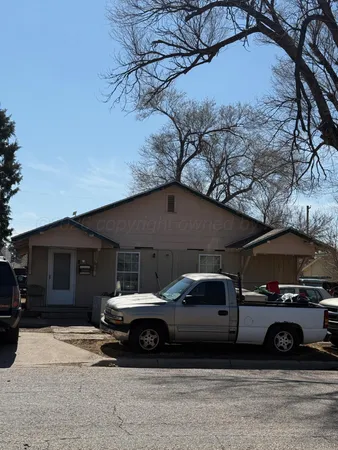 a car parked in front of a house