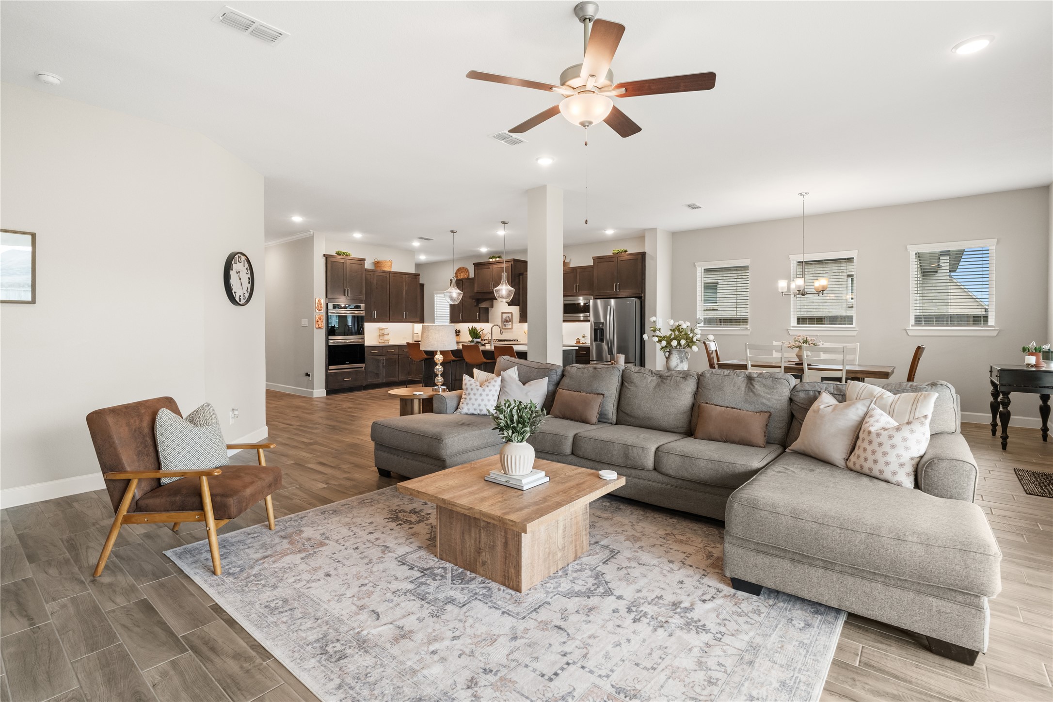 3118 Swift Way Katy, TX 77493 - Photo 15 of 34 Living Room to Kitchen View – Open living area with comfortable seating arrangement and clear sightlines into the kitchen, ideal for everyday living and entertaining.