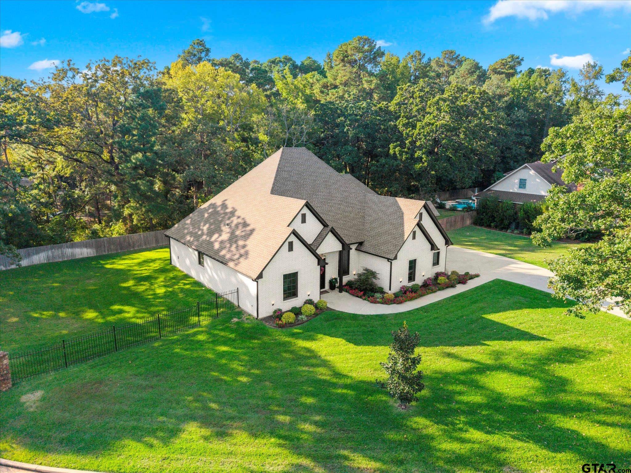 4301 Windrush Boulevard Longview, TX 75604 - Photo 33 of 36 an aerial view of a house with swimming pool garden and mountain view in back