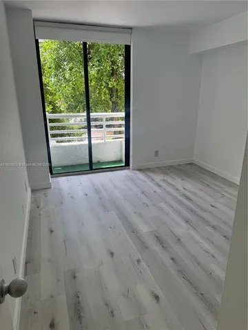 wooden floor in an empty room with a gallery