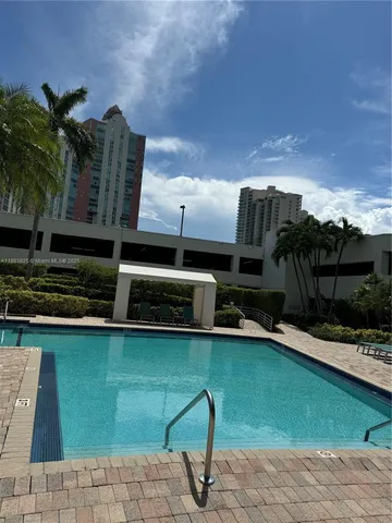 a view of a backyard with trampoline