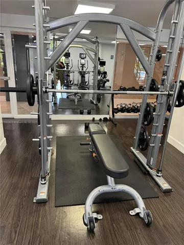 a room with gym equipment and a large window