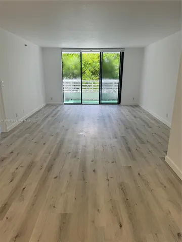a kitchen with granite countertop a stove and a microwave